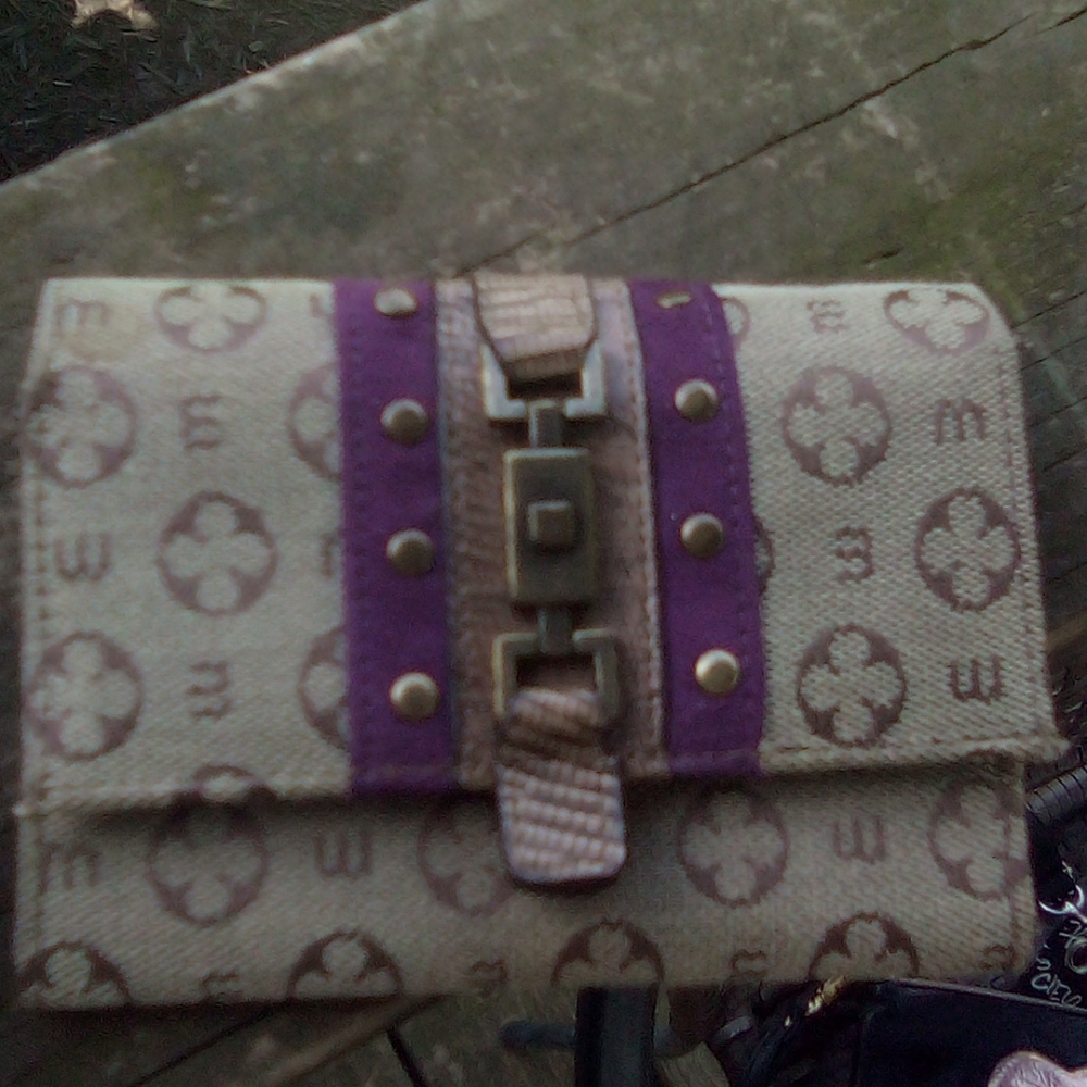 A tan and brown Wallet.